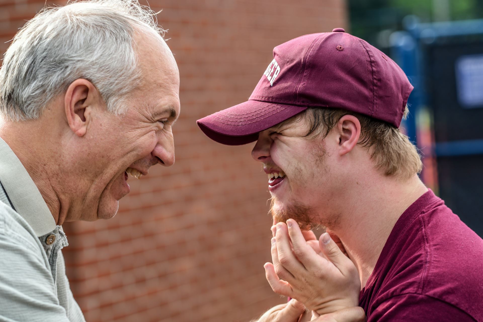 Man and boy laughing